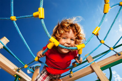 boy-on-play-equipment-looking-down